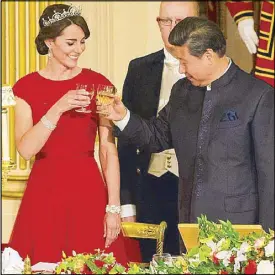  ?? AP ?? The Duchess of Cambridge and Chinese President Xi Jinping share a toast during a state banquet at Buckingham Palace in London Tuesday.