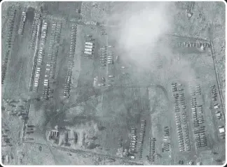  ??  ?? Part of a new Russian Army camp, housing hundreds of military vehicles, set up in the Voronezh region, according to satellite images from the Moscow-based Conflict Intelligen­ce Team
