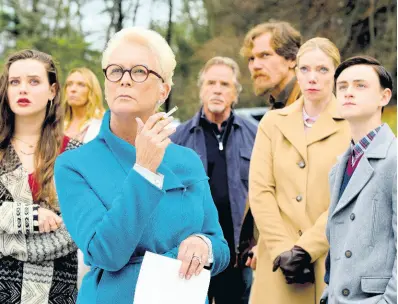  ?? AP ?? Katherine Langford, from left, Toni Collette, Jamie Lee Curtis, Don Johnson, Michael Shannon, Riki Lindholm and Jaeden Lieberher in a scene from ‘Knives Out.’