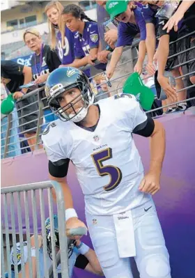  ?? KARL MERTON FERRON /BALTIMORE SUN ?? Joe Flacco takes the field before the game against the Lions. “It felt really good,” Flacco said of his return. “… To be out there with the guys, that’s what it’s all about.”