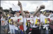  ?? ARIANA CUBILLOS/THE ASSOCIATED PRESS ?? Woman wearing shirts showing the face of jailed opposition leader Leopoldo Lopez protest Saturday to demand a recall referendum against Venezuela’s President Nicolas Maduro in Caracas, Venezuela.