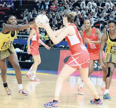  ?? COLLIN REID PHOTO COURTESY OF PETROJAM, SUPREME VENTURES, COURTS AND SCOTIABANK ?? Jamaica’s goal defence (left) Vangelee Williams competes for the ball with England’s goal shooter, Joanne Harten, while Jamaica’s Stacian Facey (right) and England’s Pamela Cookey (second right) look on, during the Netball World Cup bronze medal match at Allsport Arena in Sydney, Australia, on Sunday. England won 66-44.