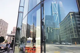  ??  ?? Top: The Lumina towers are key to making Rincon Hill a real residentia­l neighborho­od. Above: Salesforce Tower is reflected in Lumina’s facade.