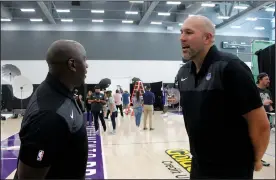  ?? MIKE BUSH/NEWS-SENTINEL ?? Sacramento Kings assistant coach Phil Ricci (right) talks to fellow assistant coach Bobby Jackson during the team's Media Day at their practice facility inside the Golden 1 Center on Monday. Ricci, a former Galt High boys basketball coach, enters his second season coaching with the NBA squad.