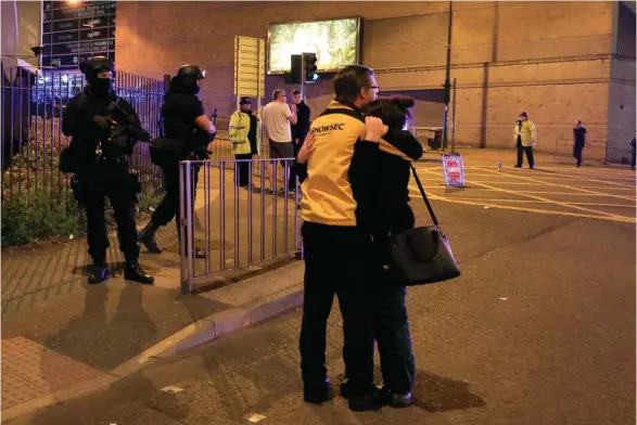  ?? (Photo by Peter Byrne, PA via AP) ?? Armed police stand guard at Manchester Arena after reports of an explosion at the venue during an Ariana Grande gig in Manchester, England Monday, May 22, 2017. Police says there are "a number of fatalities" after reports of an explosion at an Ariana...