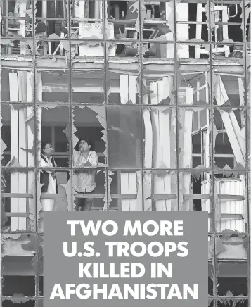  ?? JAWAD JALALI, EUROPEAN PRESSPHOTO AGENCY ?? Window panes were left shattered after a blast in Kabul on Saturday. Several people, including American contractor­s, were killed in a suicide car bombing.