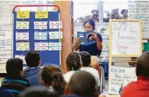  ?? Mark Mulligan / Staff file photo ?? Kelso Elementary teacher Cathy Hayes, pictured in 2018, leads peer reading time. Kelso likely will be at the top of the list for renovation­s when voters pass HISD’s next bond.