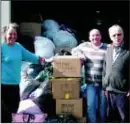  ??  ?? LEEDS Val Mogendorff, Andy Ingleby and Dolf Mogendorff with donated winter clothing for communitie­s in Eastern Europe as part of World Jewish Relief’s Operation Winter Survival