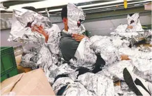  ??  ?? ... Seven Iraqi refugees, who tried to hide from an x-ray detector by wrapping themselves in aluminium foil inside a shipping container in a truck, were caught by Turkish customs officials at Pendik Port in Istanbul on Wednesday. The x-ray scanner...