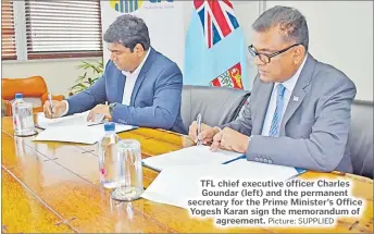 ?? Picture: SUPPLIED ?? TFL chief executive officer Charles Goundar (left) and the permanent secretary for the Prime Minister’s Office Yogesh Karan sign the memorandum of agreement.