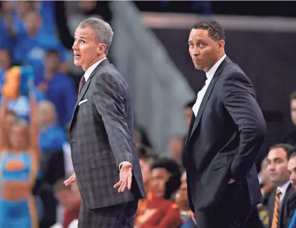  ?? AP FILE PHOTO ?? Former Southern California men’s assistant basketball coach Tony Bland, right, was fired by the school in January 2018 and later pleaded guilty to conspiracy to commit bribery. USC’S Andy Enfield, also pictured, remains as head coach.