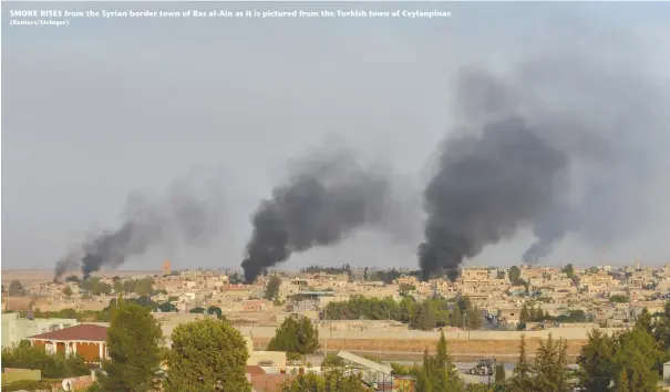  ?? (Reuters/Stringer) ?? SMOKE RISES from the Syrian border town of Ras al-Ain as it is pictured from the Turkish town of Ceylanpina­r.