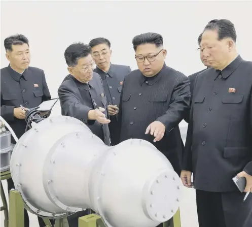  ??  ?? North Korea released pictures of Kim Jong-un inspecting a supposed nuclear device after state television announced blast