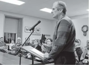  ?? [LIZ BEVAN / THE OBSERVER] ?? Committee of adjustment chair Dennis Weber speaks out against the township’s plan to have council take over the role, discussed Tuesday night in Crosshill.