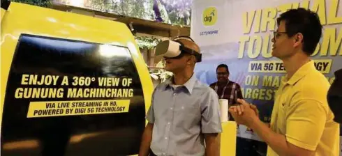  ??  ?? DIGI dan MAHB memulakan pengalaman pelanconga­n maya masa nyata pertama Malaysia yang dikuasakan 5G di LGK.