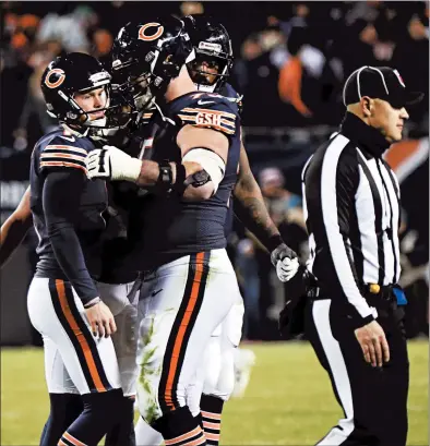  ?? JOHN J. KIM/CHICAGO TRIBUNE ?? Bears kicker Cody Parkey is consoled by guard Kyle Long after Sunday’s season-ending play.