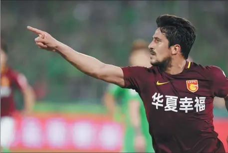  ?? XINHUA ?? Aloisio celebrates scoring for Hebei China Fortune during a Chinese Super League match against Beijing Guo’an in 2017.