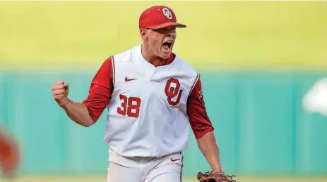  ?? [PHOTO BY BRYAN TERRY, THE OKLAHOMAN] ?? Oklahoma’s Austin Hansen celebrates after a win over Kansas on Friday in the Big 12 Baseball Tournament at Chickasaw Bricktown Ballpark. The Sooners beat the Jayhawks and advanced to play Baylor at 9 a.m. Saturday.