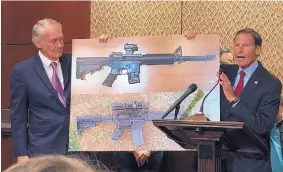  ?? MATTHEW DALY/ASSOCIATED PRESS ?? Sen. Edward Larkey, D-Mass., left, and Sen. Richard Blumenthal, D-Ct., display a photograph of a plastic gun on Tuesday on Capitol Hill in Washington.