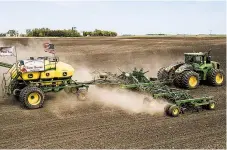  ?? DAN ERDMANN/FARM RESCUE ?? Volunteers plant crops in June on Paul Ivesdal’s farm while he was sickened by COVID-19.