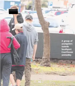  ??  ?? A group of youngsters outside Southport Courthouse yesterday.