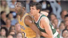  ?? 1987 PHOTO BY RICK STEWART, GETTY IMAGES ?? James Worthy, left, and Kevin McHale were two of the Hall of Famers central to the Lakers-Celtics rivalry in the 1980s.