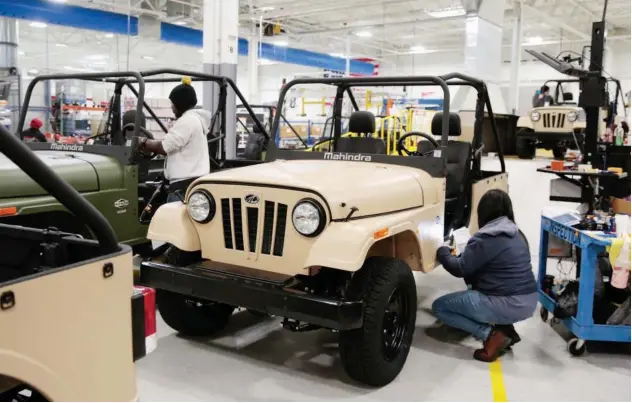  ?? Reuters ?? Engineers inspect ‘Roxor’ vehicles at Mahindra’s plant in Michigan, US.