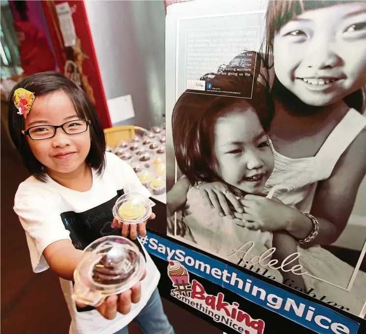  ?? — Photo: NORAFIFI EHSAN/ The Star ?? Leah Choy, seven, learnt how to bake to raise funds for her sister, who has cerebral palsy. Now, she raises funds for various causes including the disabled and the Rohingya boat people.