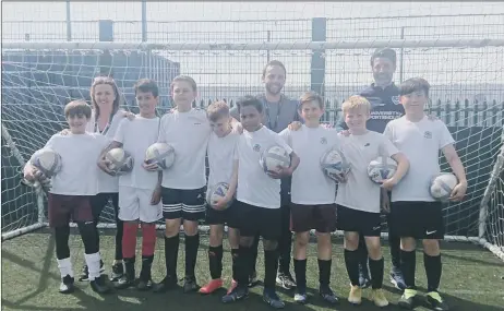  ?? ?? EXCITED Danny Cowley with Meon Junior School teachers Michael Spencer and Shellie Knight and squad members Leo Higgins, Lewis Hamza, Lorenzo Jay, Teddy Nightingal­e, Freddie Seabrook, Rafael Taylor-Stoakes, Anbiya Habibi, and Leon Young