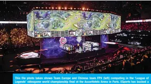  ??  ?? This file photo taken shows Team Europe and Chinese team FPX (left) competing in the ‘League of Legends’ videogame world championsh­ip final at the AccorHotel­s Arena in Paris. ESports has bucked a grim trend to stage a world championsh­ip in Shanghai, even as numerous internatio­nal sports tournament­s across the globe are wiped out by the COVID-19 coronaviru­s. —AFP