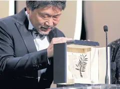  ?? REUTERS ?? Director Hirokazu Kore-eda is humbled after winning the Palme d’Or award for his film Shoplifter­s.