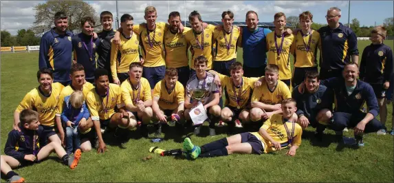  ??  ?? Rosslare Rangers ‘B’ celebrate after beating Wexford Albion to win the Billy Browne Cup in Ferrycarri­g Park on Sunday.