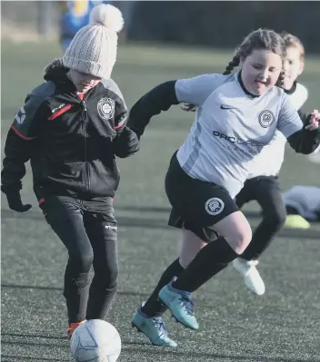  ??  ?? Lumley Ladies Under-9s (black/red) v Pro Direct Teesside (white).