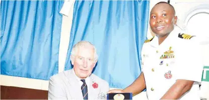  ??  ?? Prince Charles of Wales with Commanding Officer NNS EKULU, Commander Andrew Zidon