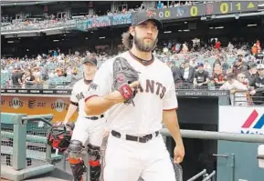  ?? Lachlan Cunningham Getty Images
By Kevin Baxter ?? THREE-FIFTHS of the rotation may be on the DL, but as long as Madison Bumgarner stays healthy, the Giants will too. He almost single-handedly won World Series last year.
