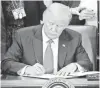  ?? PABLO MARTINEZ MONSIVAIS, AP ?? President Trump signs an executive order on immigratio­n last month. His moratorium on immigrants from seven majorityMu­slim nations has been challenged in court.