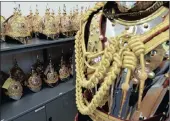  ?? PICTURE: REUTERS ?? HEAD TO TOE: Rows of helmets in the Full Dress Store of the Household Cavalry, which will provide ceremonial support at the royal wedding on Saturday, at the Hyde Park Barracks in London, this week