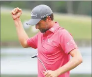  ?? Cliff Hawkins / Getty Images ?? Webb Simpson celebrates on the 18th green after winning during the final round of The Players Championsh­ip on Sunday in Ponte Vedra Beach, Fla.