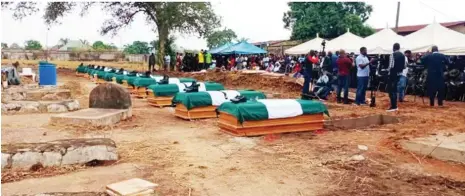  ??  ?? The coffins of 12 Soldiers killed by a local mlitia in Bonta community of Konshisha Local Government Area of Benue State