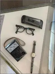  ?? (For The Washington Post/Larry Bleiberg) ?? Artifacts in the “Legacy of a Dream” exhibit include King’s glasses, watch and transistor radio, which he carried during civil rights marches.