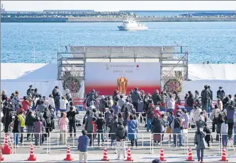  ?? AP ?? People turn up to see the Olympic Flame in Fukushima, Japan, on Wednesday, a day after the Games were postponed to 2021.