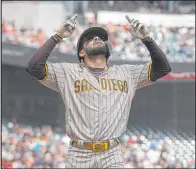  ?? Jeff Chiu The Associated Press ?? Fernando Tatis Jr. celebrates after hitting a third-inning home run for the Padres in their 7-4 victory over the Giants on Thursday.