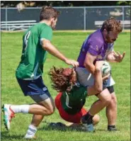  ?? DEBBY HIGH/FOR DIGITAL FIRST MEDIA ?? Brian Noone held onto the ball against the aggression of Blackthorn’s hold during Saturday’s Rugby Club’s Annual 7’s Tournament.