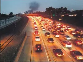  ?? Marc Martin Los Angeles Times ?? MOTORISTS are backed up on the 105 Freeway after a deadly collision between a tanker truck and a Range Rover. The road was closed for several hours.