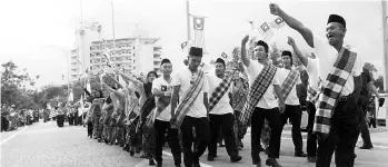  ??  ?? The contingent­s taking part in the Malaysian Day celebratio­n held at the Labuan Square yesterday. - Bernama photo