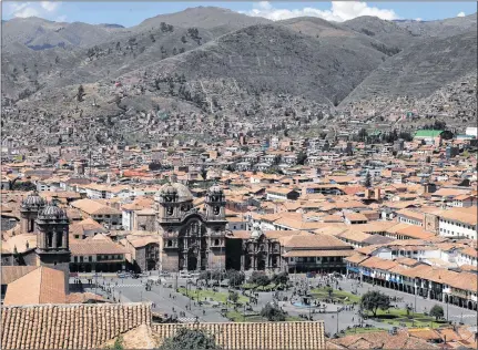  ?? MARTIN MEJIA/THE ASSOCIATED PRESS ?? Cuzco’s main plaza, photograph­ed May 2, 2018, dominates the Peruvian city. Cuzco was the capital of the ancient Inca Empire, and from the 16th to 18th centuries it became an epicentre for Catholic-themed art under Spanish colonizers.