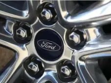  ?? JUSTIN SULLIVAN/GETTY IMAGES ?? Ford’s internatio­nal recall includes various vehicle models from 2010 to 2015. Their engines can overheat and catch fire if the coolant gets low.