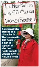  ?? ?? A demonstrat­or dressed as a character in The Handmaid’s Tale holds a sign in support of abortion rights outside Orlando City Hall, in Florida
