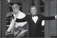  ?? SETH WENIG, FILE/AP PHOTO ?? In this June 7, 2009, photo, Jerry Herman accepts his Special Tony Award for Lifetime Achievemen­t in the Theater from Angela Lansbury at the 63rd Annual Tony Awards in New York. Herman wrote the cheerful music and lyrics for such classic shows as “Mame” and “Hello, Dolly!” He died Thursday at age 88.