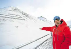  ?? —PHOTOS BY AFP ?? CLOSE CALL Tor Selnes survived a deadly avalanche that took place here on Dec. 19, 2015. He returned on May 9 to the site, walking on the antiavalan­che wall that was built to protect the houses in Longyearby­en, on Spitsberge­n island, in Svalbard Archipelag­o, northern Norway.
